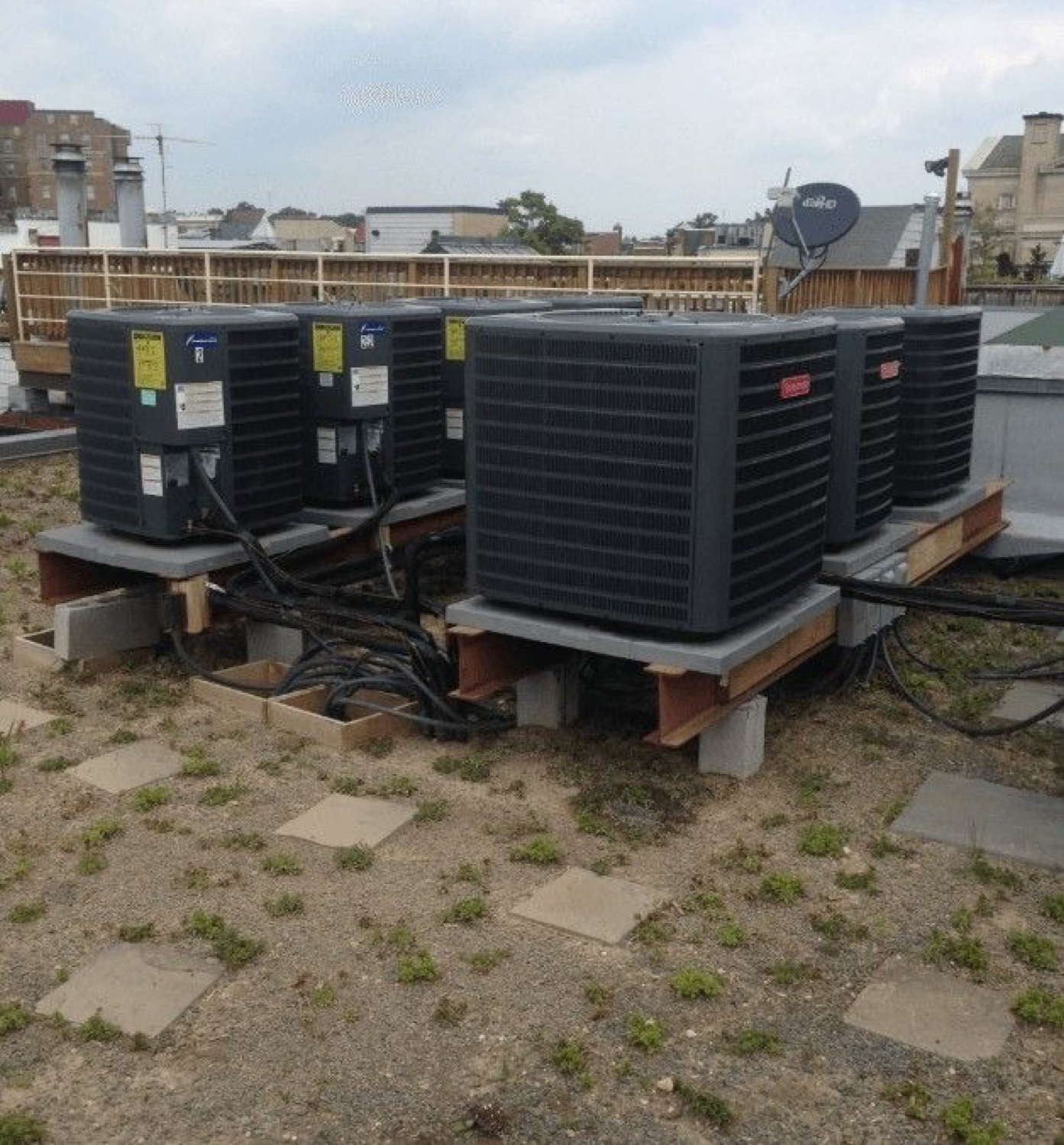 Row of new Carrier condensing units for a multi-system property